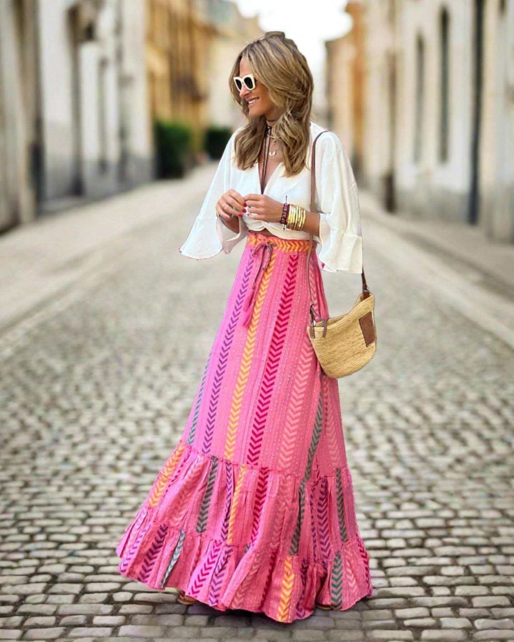 Vibrant pink polyester skirt with flowing hem and retro geometric print