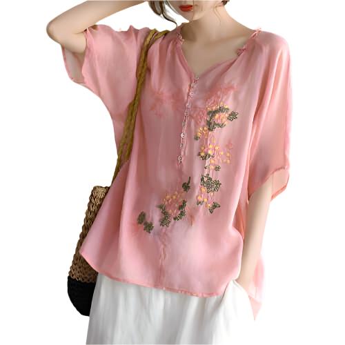 Bohemian cotton blouse featuring embroidered flowers 